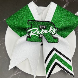 Custom Cheer Bows designed in your team colors. Price listed Is per Individual cheer bow made with or without pop-out center, glitter bow