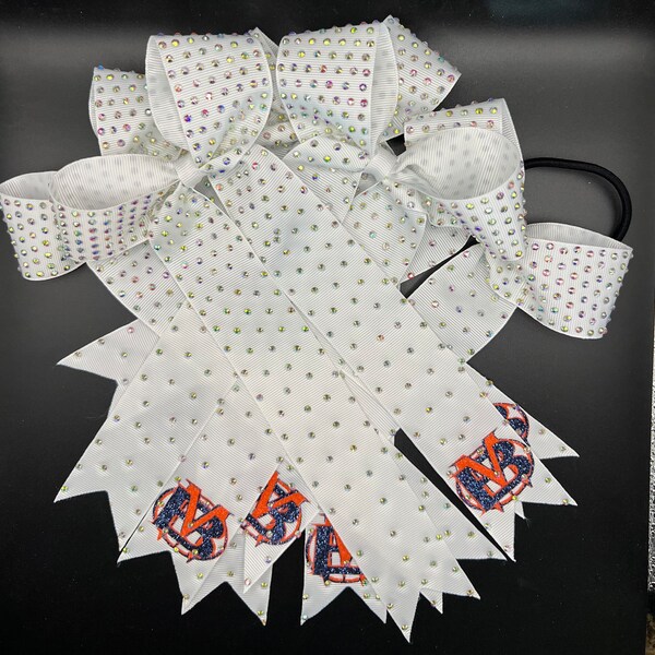 Custom college cheer bows designed in your team colors with or without logo. Price listed Is per Individual bow, team cheer bow, College bow