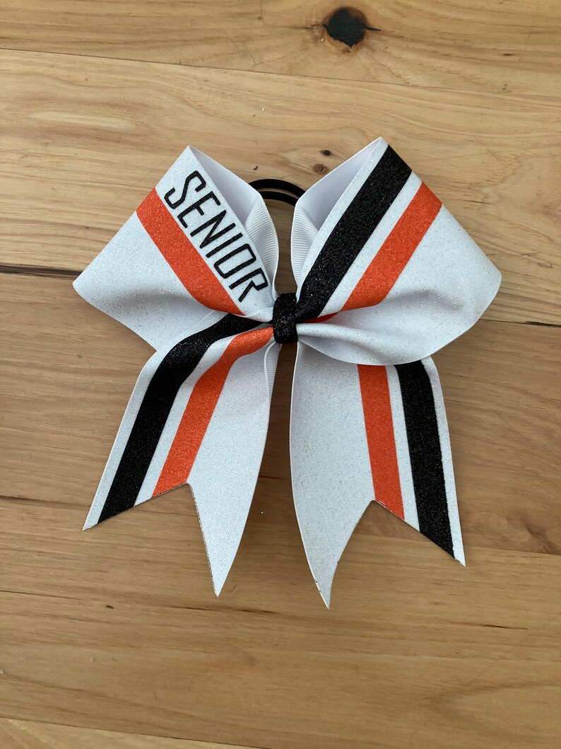 Price listed below is per bow price. Orange and Black glitter Cheer Bow custom made for your team White