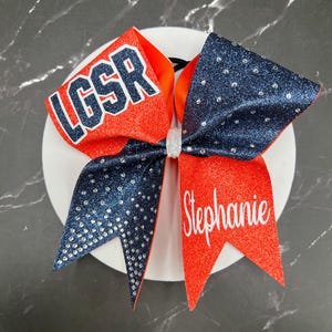 All Glitter competition cheer bow with rhinestones and personalized names.  Price listed is per individual bow. Comment colors at checkout.