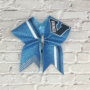 All glitter cheer bow made in your team colors. Price listed is per individual bow. Glitter bow, team bows competition bow, game day bow.