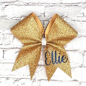 Bow Glitter Keychain made in your team colors. Comment colors at checkout. Cheer keychain, bow keychain, personalized keychains