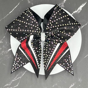 Custom glitter cheer bow covered in rhinestones. Bows made in your teams Colors. Price lIsted is per individual bow.