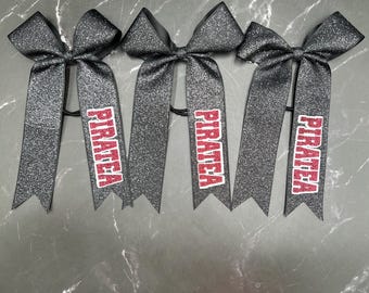 Light glitter dazzle college bows with 6 inch tails. Writing on bottom tail. Price is per skinny bow, College bows, collegiate bows, skinny