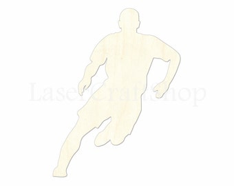 May include: A wooden cutout of a person running, in a soccer or football pose. The cutout is unpainted and has a natural wood grain.