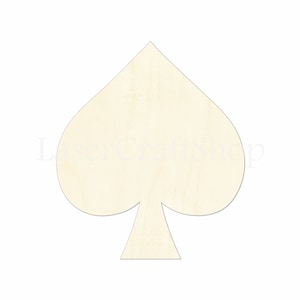 May include: A wooden cutout of a spade playing card shape. The cutout is unpainted and has a natural wood color.