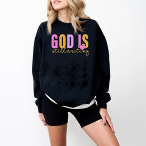 18000 Unisex Heavy Blend™ Crewneck Sweatshirt - God is Still Writing