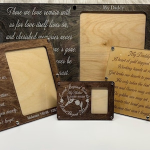 May include: Four wooden picture frames with engraved messages and a small photo insert. The frames are made of light brown wood with a dark brown border. The messages are about love and loss. The frames are perfect for displaying photos of loved ones who have passed away.