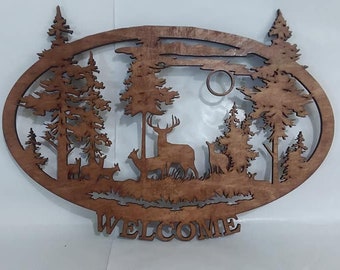 Welcome sign, deer in the woods, forest scene, welcome written on bottom of laser cut wooden sign.