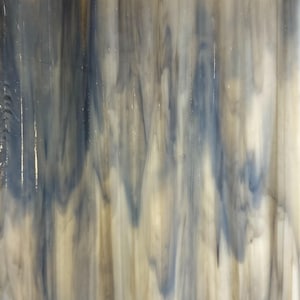 May include: Abstract glass panel with a flowing pattern of blue, gray, and cream colors. The design features vertical streaks and a textured appearance, suitable for decorative applications.