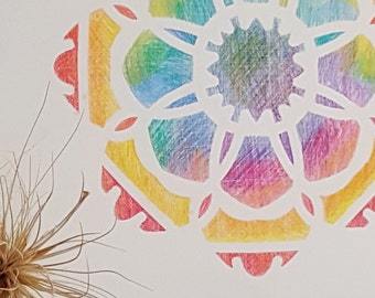 Mandala stencil coloured with pencils