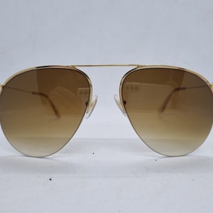 Vintage BAUSCH & LOMB 1/30 sunglasses 10 kt gold frame 1970s half rime brown lenses Sunglasses Made in USA 1970s mint condition.