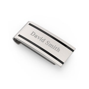 May include: Silver money clip with black stripes and the name "David Smith" engraved on the front.