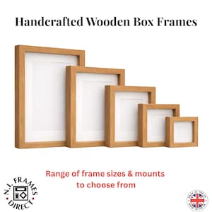 May include: A selection of handcrafted wooden box frames in different sizes. The frames are made of light-coloured wood and have white mounts. The text "Handcrafted Wooden Box Frames" is at the top. The text "Range of frame sizes & mounts to choose from" is at the bottom.