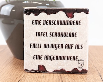 A missing bar of chocolate... saying tile / stone coaster
