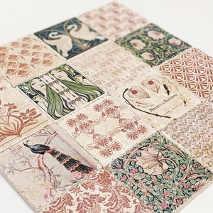 May include: A set of square coasters with diverse vintage designs. The coasters display images of swans, floral patterns, and Art Nouveau figures in green, red, and beige. The coasters are arranged in a square formation.