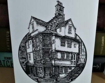 May include: Black and white ink drawing of a historic building with a circular frame. The building has a tall, narrow tower and multiple windows. The drawing is on a white background.