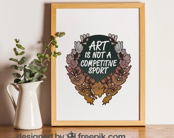 May include: A framed print with a floral wreath design and the text "Art is not a competitive sport". The background is a dark green color.