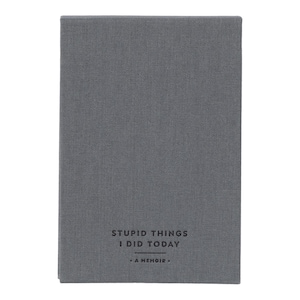 May include: A gray linen-covered journal with the text "Stupid Things I Did Today - A Memoir" printed on the front.