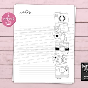 May include: Printable notes page featuring a black and white illustration of a row of cameras. The page has the text "notes" at the top and "papeterie inspirante à colorier" at the bottom. The page also has the text "PAGE DE NOTES PASSION PHOTO" at the bottom.