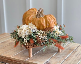Fall farmhouse pumpkin Centerpiece, weathered orange Pumpkin on a mango beaded riser with greenery and flowers, Greenery with cream flowers