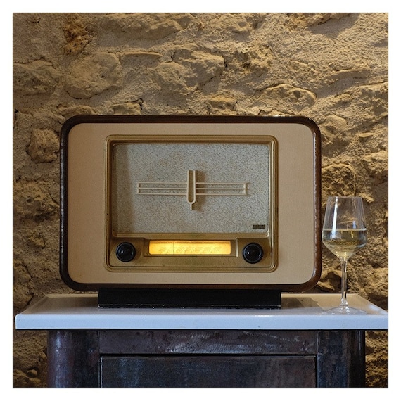 A genuine Art Deco French tube radio, fully restored and secretly upgraded with Bluetooth and WiFi — vintage soul meets modern streaming.