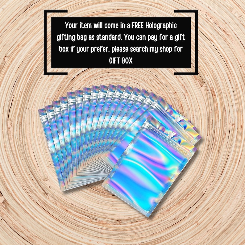 May include: A fan-shaped arrangement of multiple rectangular holographic pouches with a metallic sheen. The text reads: Your item will come in a FREE Holographic gifting bag as standard. You can pay for a gift box if your prefer, please search my shop for GIFT BOX.