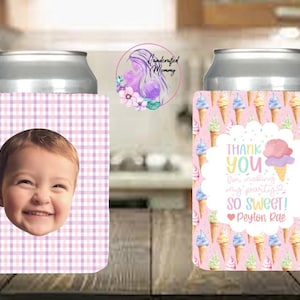 May include: Two can coolers. One features a baby's face on a pink and white plaid background. The other has an ice cream cone design with the text "Thank You for making my party so sweet!" and a name.