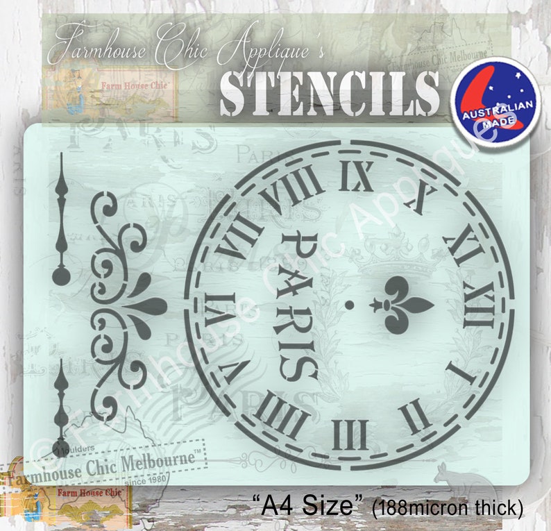 Op de afbeelding: Een grijze stencil van een wijzerplaat met Romeinse cijfers en het woord "PARIS" in het midden. De stencil is op een lichtblauwe achtergrond en is gelabeld "A4 Size" (188 micron dik).