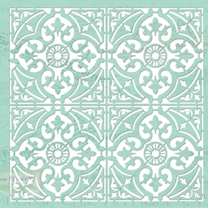 May include: A white stencil featuring a repeating pattern of intricate floral designs. The stencil is set against a light blue background. The stencil is labelled "No. 9".