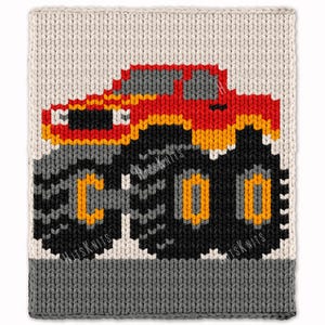 May include: A rectangular knitted panel featuring a red and orange monster truck graphic on a cream background. The truck has large black tires with orange rims. A solid gray knitted border runs along the bottom edge of the textured fabric piece.