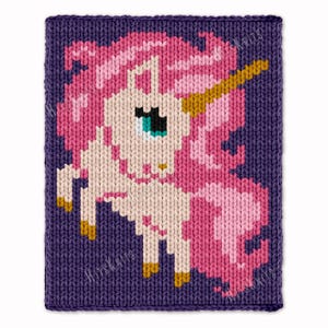 May include: A knitted square featuring a pixelated unicorn design. The unicorn has a pink mane and tail, a golden horn, and a teal eye. The background is a deep purple, and the piece is likely handmade.