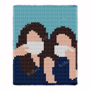 May include: A knitted square featuring a pixelated image of two figures with brown hair, wearing white masks, and blue clothing. The background is light blue. The text "HitsKnits" is visible in the lower corners.