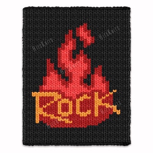 May include: Black knitted square with a pixelated design of red flames and the word "ROCK" in yellow. The flames are in the center, with the text below. The background is a dark, textured knit.