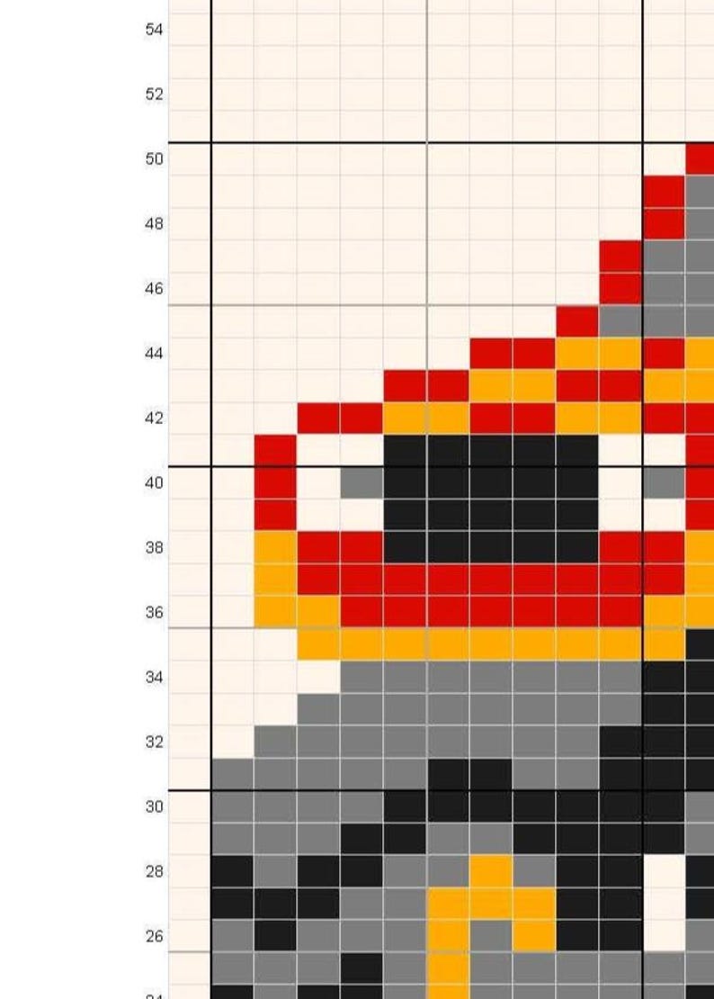 May include: A pixelated image of a character's face, rendered in a grid pattern. The design features a combination of red, yellow, gray, and black squares, creating a retro aesthetic. The image is a close-up of the character's face.