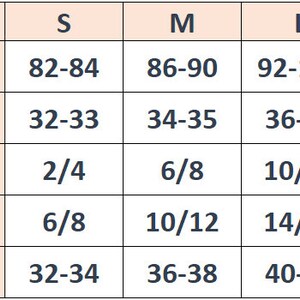 May include: A size chart table with a light peach background and dark blue text. It lists sizes S, M, L, and XL with corresponding chest circumference measurements in cm and inches, plus US, UK, and European size equivalents for each category.