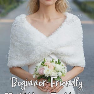 May include: A white fuzzy knit shawl with a V-neckline worn over a white dress. The image includes the text "HitsKnits" and "Beginner-Friendly Knitting Pattern" in white and black lettering. The shawl has a soft, textured, and plush appearance.