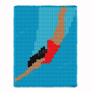 May include: A knitted blue blanket with a pixelated design of a person diving. The diver is depicted with brown, black, and red elements against a light blue background. The blanket has the text "HitsKnits" in the lower left corner.