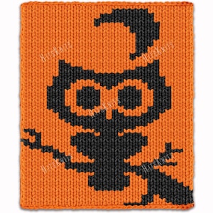 May include: A square knitted fabric piece featuring a black owl graphic centered on a vibrant orange background. The owl design is created with a pixelated, knit-stitch pattern, showing the bird perched on a branch with a curved tail above.