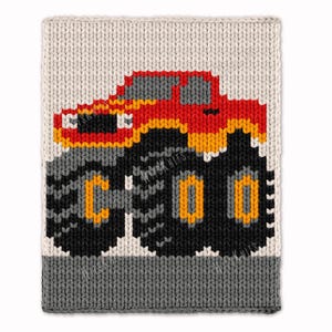 May include: A knitted blanket featuring a red and yellow monster truck design. The truck has large black tires with yellow and gray accents. The background is off-white with a gray border at the bottom.