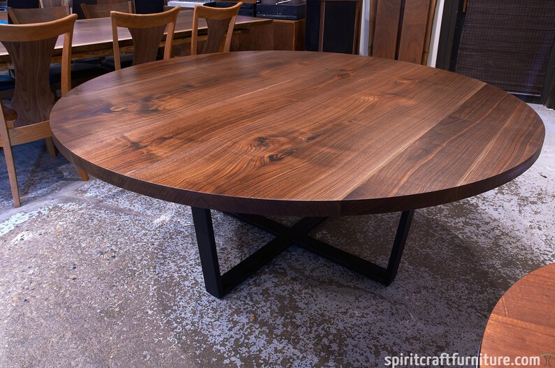 A Custom Round Walnut Dining Table W Welded Steel Crossed Tzoid Legs Solid Kiln Dried Hardwood Handcrafted Heirloom Quality