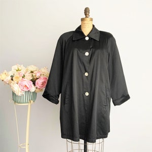 Knee length hot sale raincoat with hood