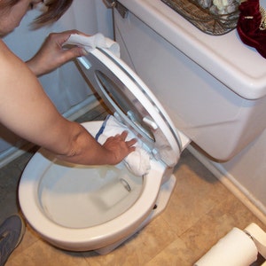 Potty training-boys training urinal-gives them the confidence they need in their aim-plastic shield clips on the toilet rim-funnels it down image 5