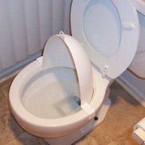 Potty training-boys training urinal-gives them the confidence they need in their aim-plastic shield clips on the toilet rim-funnels it down image 4