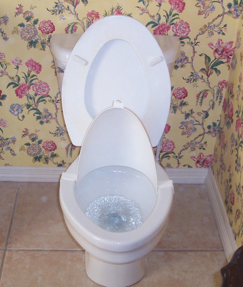 Potty training-boys training urinal-gives them the confidence they need in their aim-plastic shield clips on the toilet rim-funnels it down image 2