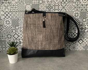 Black diamond pattern tote bag on taupe/brown background, black leather, recovered materials, handmade in Quebec by Mille et un sacs