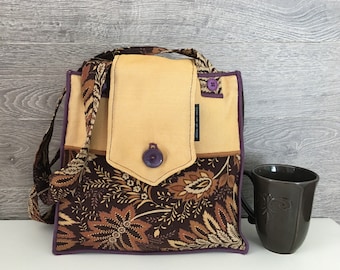 Tote bag with buttoned flap with brown, rust, purple and yellow/ocher patterns handmade in Quebec/recovered/recycled materials