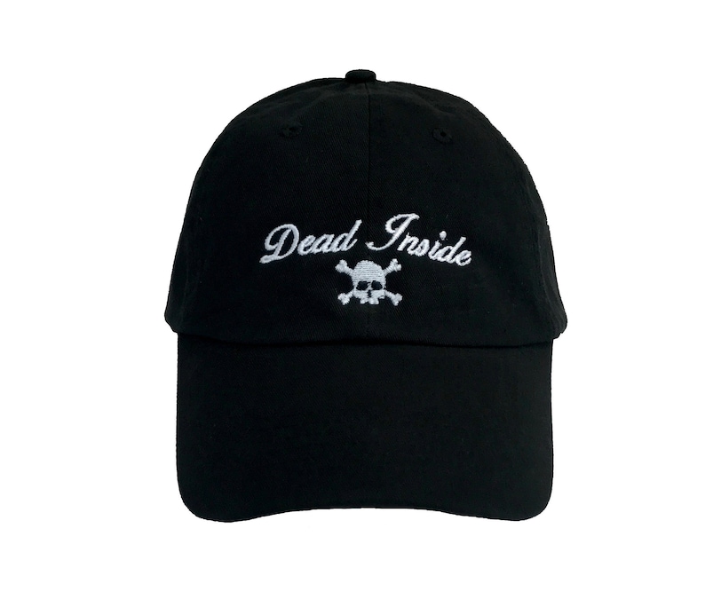 May include: Black baseball cap with white embroidery that reads "Dead Inside" with a skull and crossbones graphic.