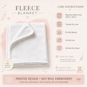 May include: A white fleece blanket with a folded corner, presented alongside care instructions including machine wash cold at 30 degrees Celsius or 90 degrees Fahrenheit, tumble dry low, do not bleach, do not iron, and do not dry clean, with text stating printed design, not real embroidery.