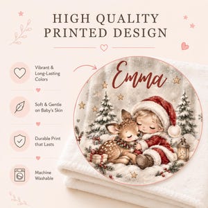 Personalized Christmas baby blanket with your baby's name — a sleeping child in a Santa hat cuddling a baby deer, a snowy first Christmas keepsake.